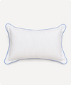 A white rectangular lumbar pillow with vertical pinstripes and a thin blue piped border, shown against a light off-white background.