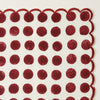 maroon polka dots with scalloped edges in hand block printed.